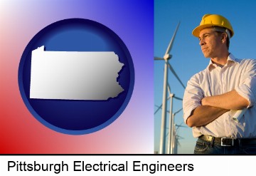 an electrical engineer, with windmills in the background in Pittsburgh, PA